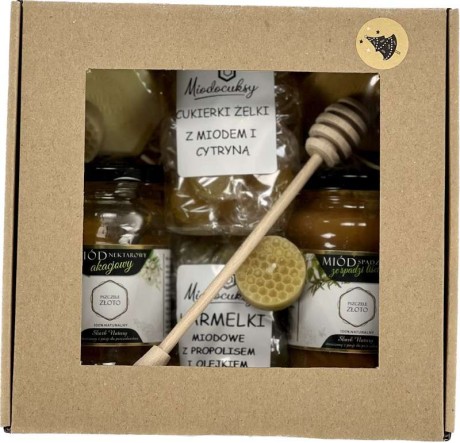 Zestaw z dwoma miodami, mydełkami, karmelkami i świeczkami
